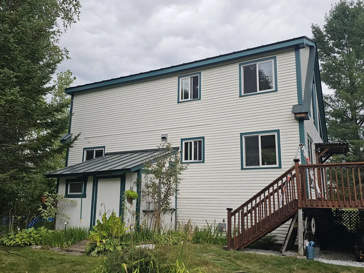 After: new fascia and trim painted dark teal