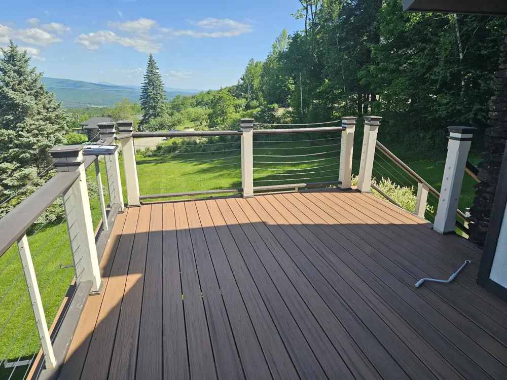 Before: old deck with painted wood posts and worn railing