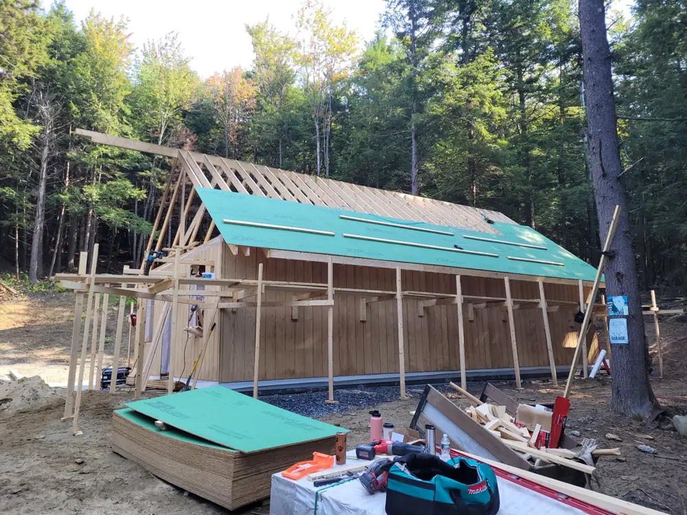 Roof rafters going up with ZIP sheathing started on one side