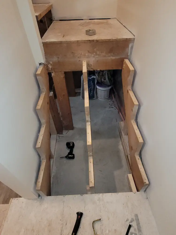 New stair stringers framed in an open stairwell